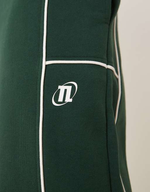 ASOS DESIGN oversized sweatpants with piping and print in green - part of a set