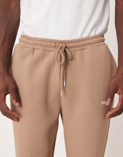 ASOS DESIGN oversized sweatpants with print in brown