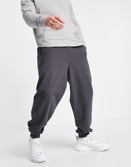 ASOS DESIGN oversized sweatpants with side panelling in black | ASOS