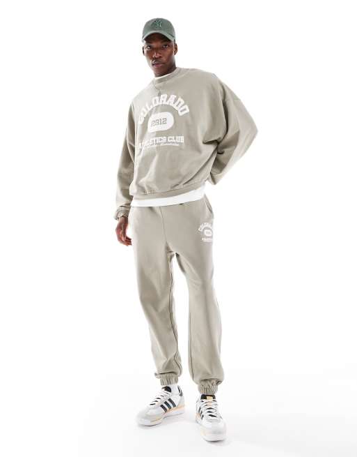 ASOS DESIGN oversized sweatpants with vintage varsity puff print in khaki
