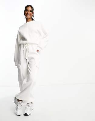 ASOS DESIGN oversized sweats jumpsuit with pockets in cream