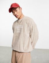 ASOS DESIGN oversized sweatshirt in acid washed green with central  embroidery