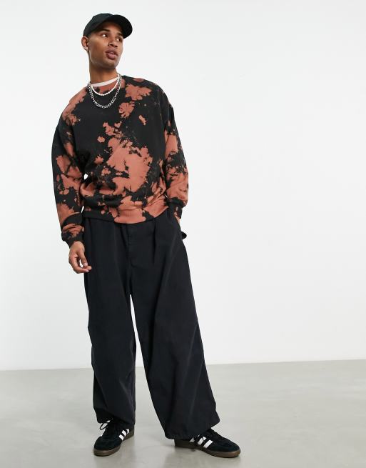 ASOS DESIGN oversized sweatshirt in black and burnt orange tie dye