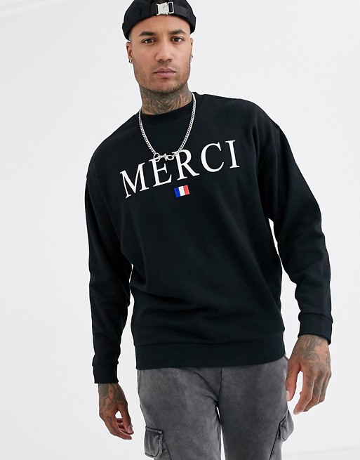 ASOS DESIGN oversized sweatshirt in black with merci print