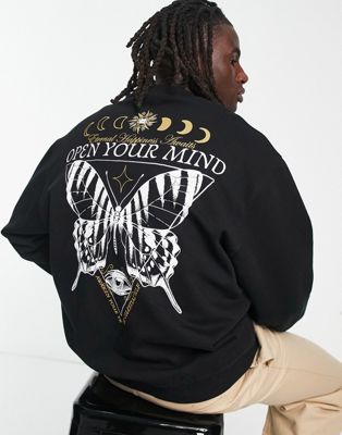 ASOS DESIGN oversized sweatshirt in black with mystic back print