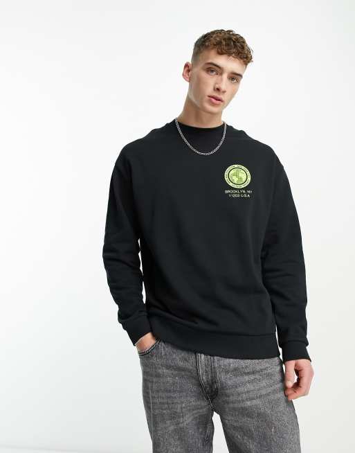 ASOS DESIGN oversized sweatshirt in black with spine back print