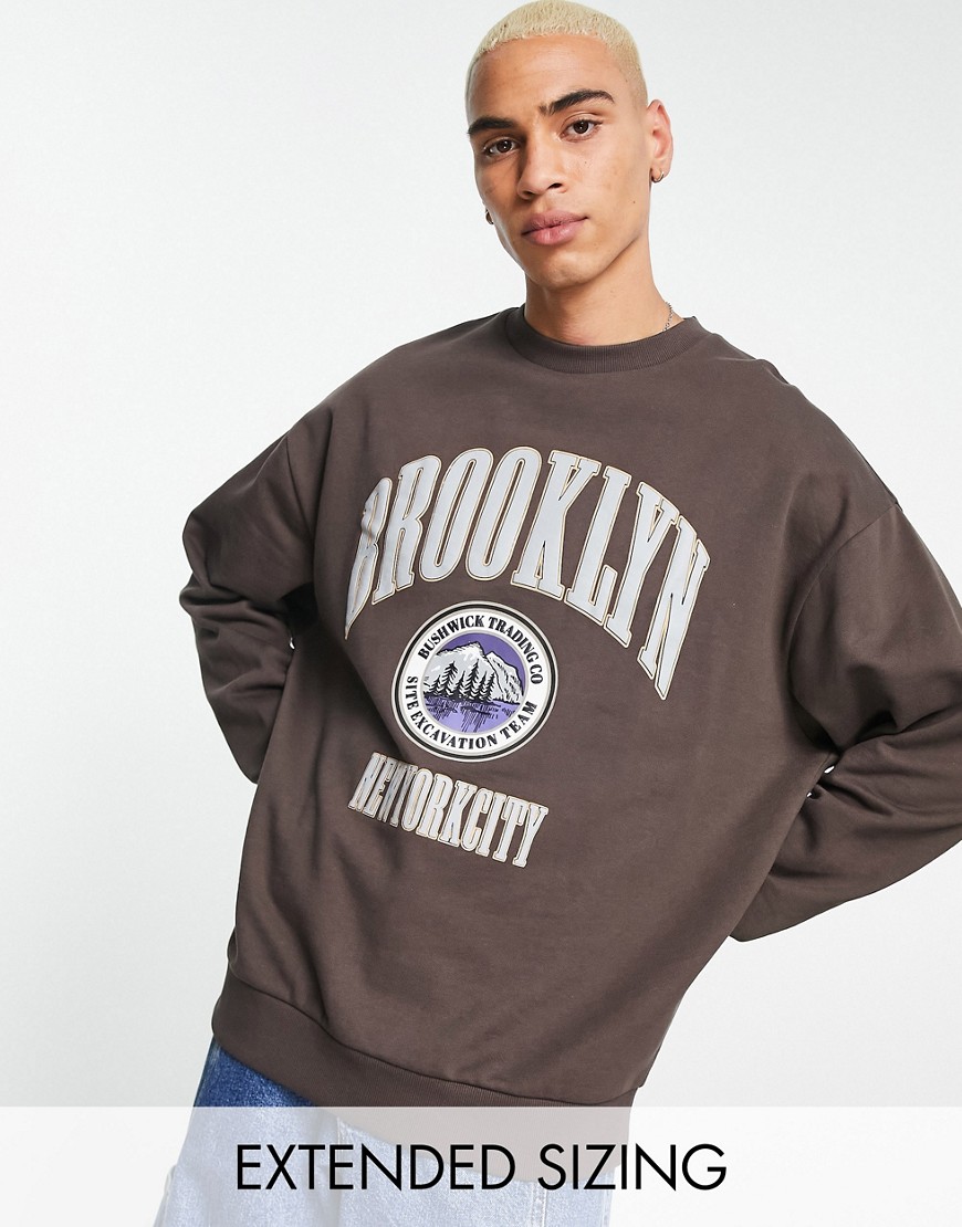 ASOS DESIGN oversized sweatshirt in brown with collegiate Brooklyn city print