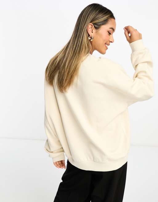 ASOS DESIGN oversized sweatshirt with raw hem in cream