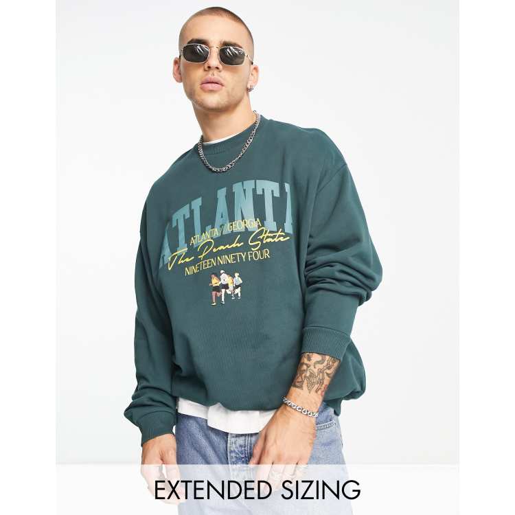 ASOS DESIGN oversized sweatshirt in dark green with collegiate front print  | ASOS