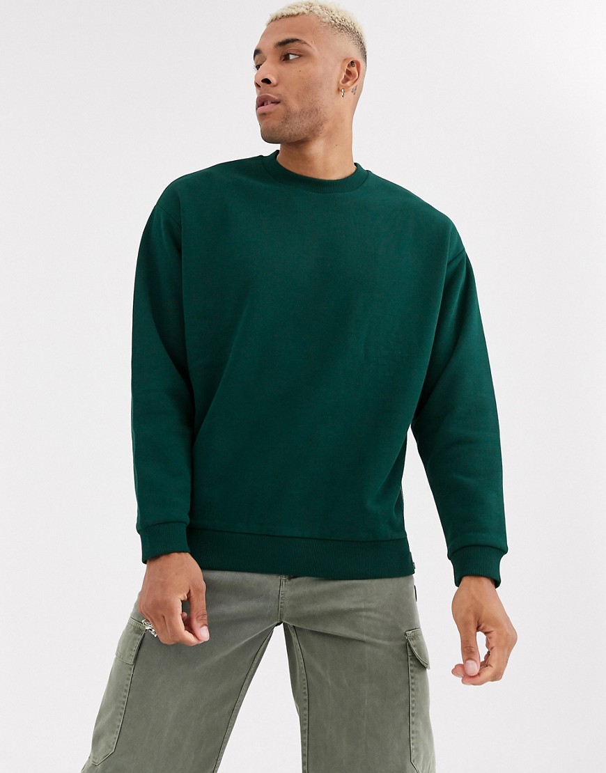 ASOS DESIGN oversized sweatshirt in dark green with silver side zips
