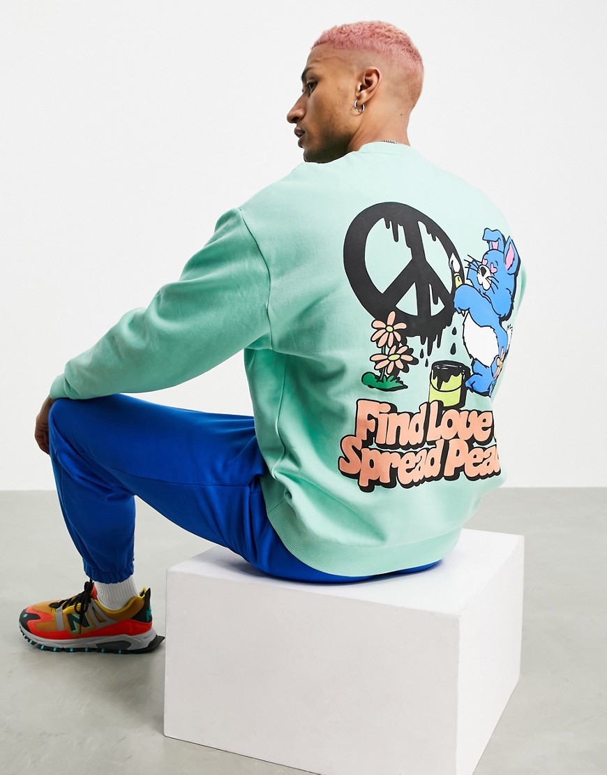 ASOS DESIGN oversized sweatshirt in green with cartoon bunny back print