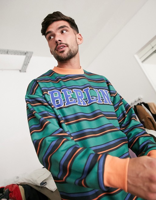 ASOS DESIGN oversized sweatshirt in multi stripes with Berlin print