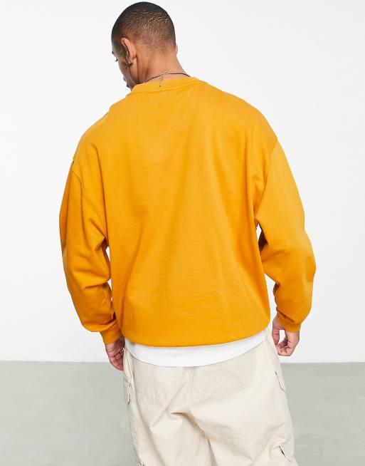 ASOS DESIGN oversized sweatshirt in bright orange