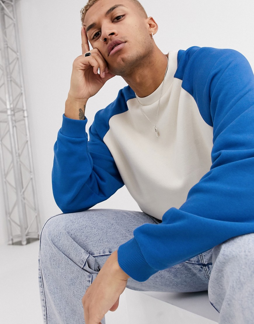 ASOS DESIGN oversized sweatshirt in off white with blue raglan sleeves