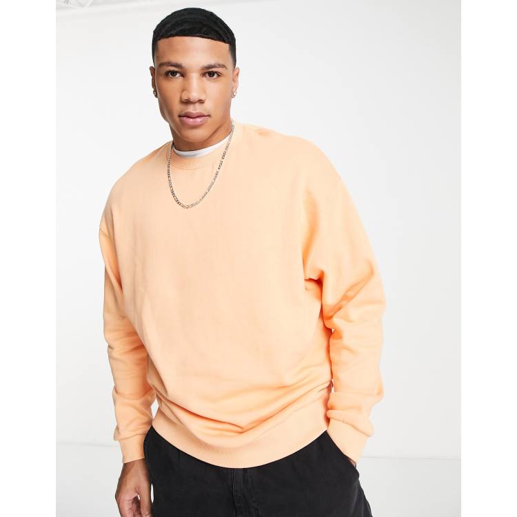 Pastel orange sweatshirt on sale