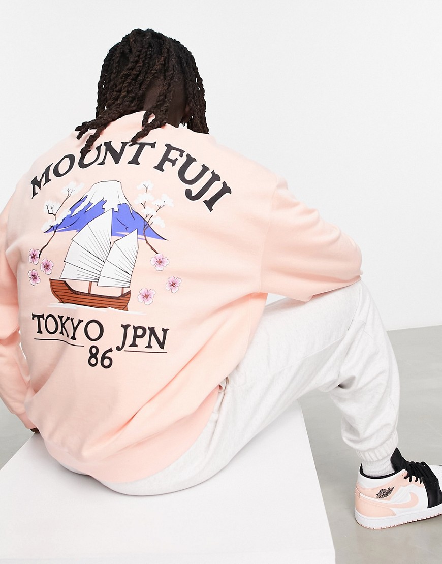 ASOS DESIGN oversized sweatshirt in pink with Tokyo back print