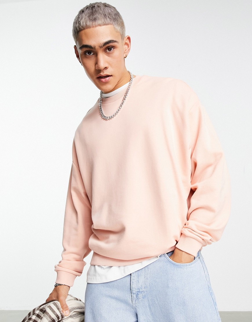 ASOS DESIGN - Oversized sweatshirt in roze met wassing