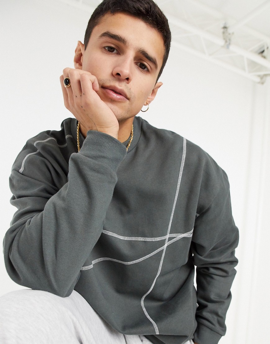 ASOS DESIGN oversized sweatshirt in washed black with contrast flat lock stitching-Grey