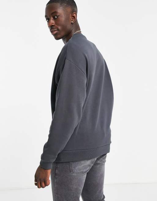 ASOS DESIGN oversized sweatshirt in washed black