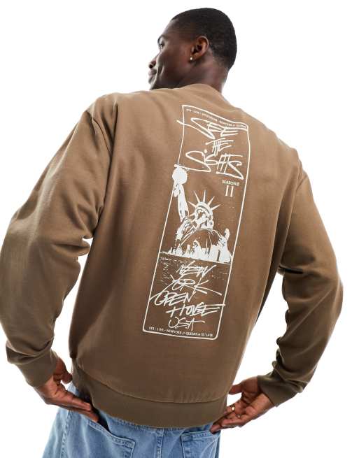 ASOS DESIGN oversized sweatshirt in washed brown with city spine print