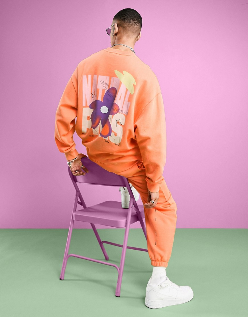 ASOS DESIGN oversized sweatshirt in washed orange with floral back print - part of a set