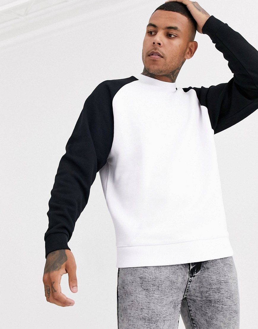 ASOS DESIGN oversized sweatshirt in white with black raglan sleeves