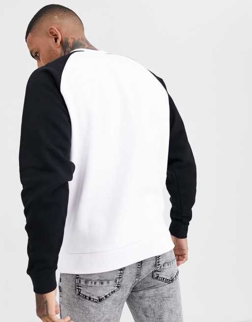 ASOS DESIGN oversized sweatshirt in white with black sleeves