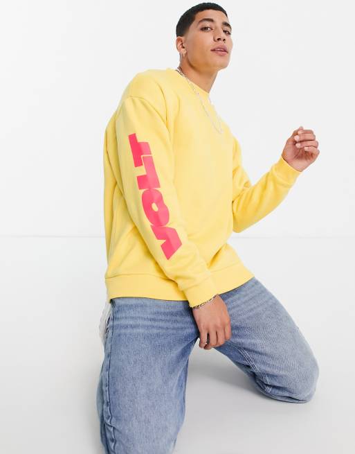 ASOS DESIGN oversized sweatshirt in yellow with multi placement text prints