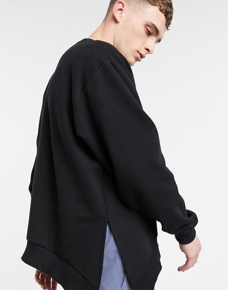 ASOS DESIGN - Oversized sweatshirt in zwart met ronde zoom