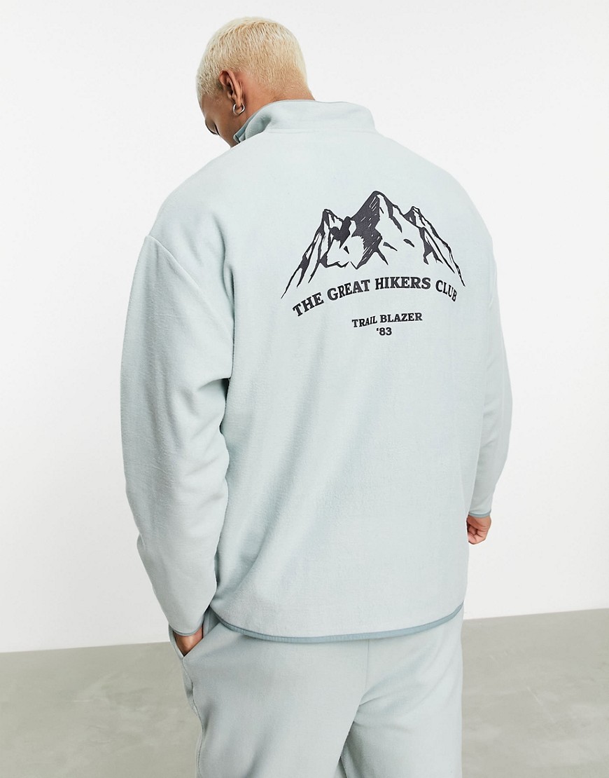 ASOS DESIGN - Oversized sweatshirt met halve rits van polar fleece in groen met bergprint