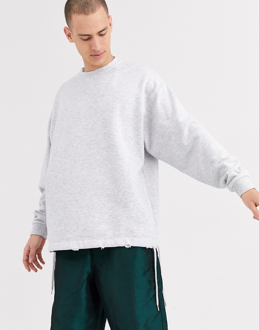 ASOS DESIGN - Oversized sweatshirt met lange mouwen en slijtage in gemêleerd wit