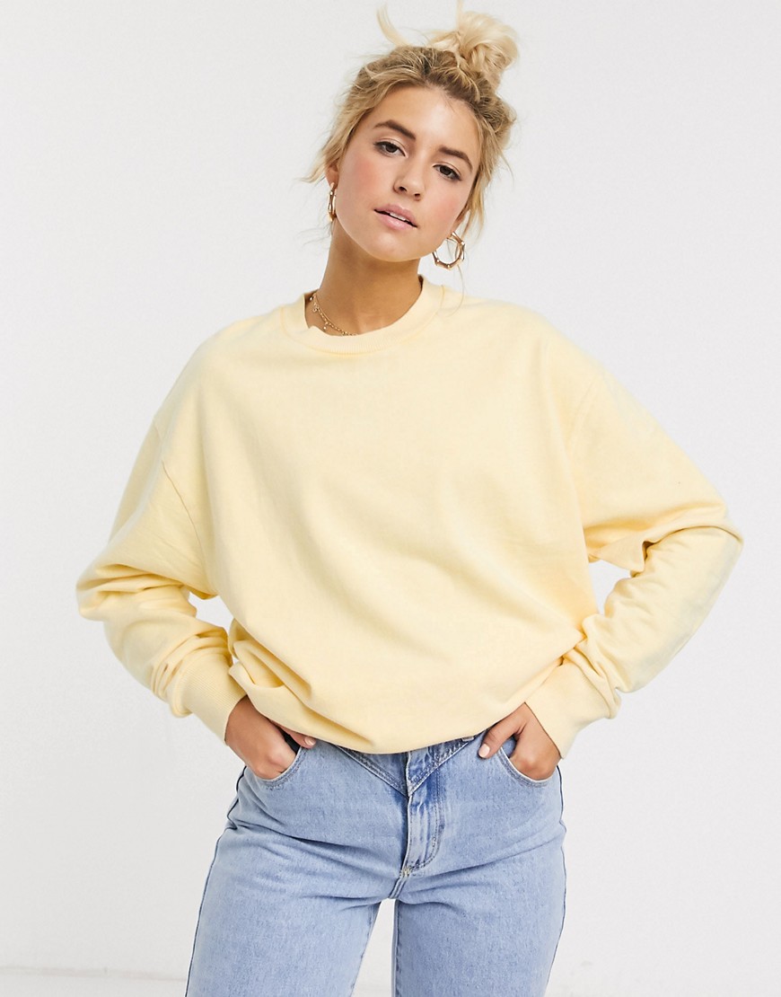 ASOS DESIGN - Oversized sweatshirt met wassing in citroengeel