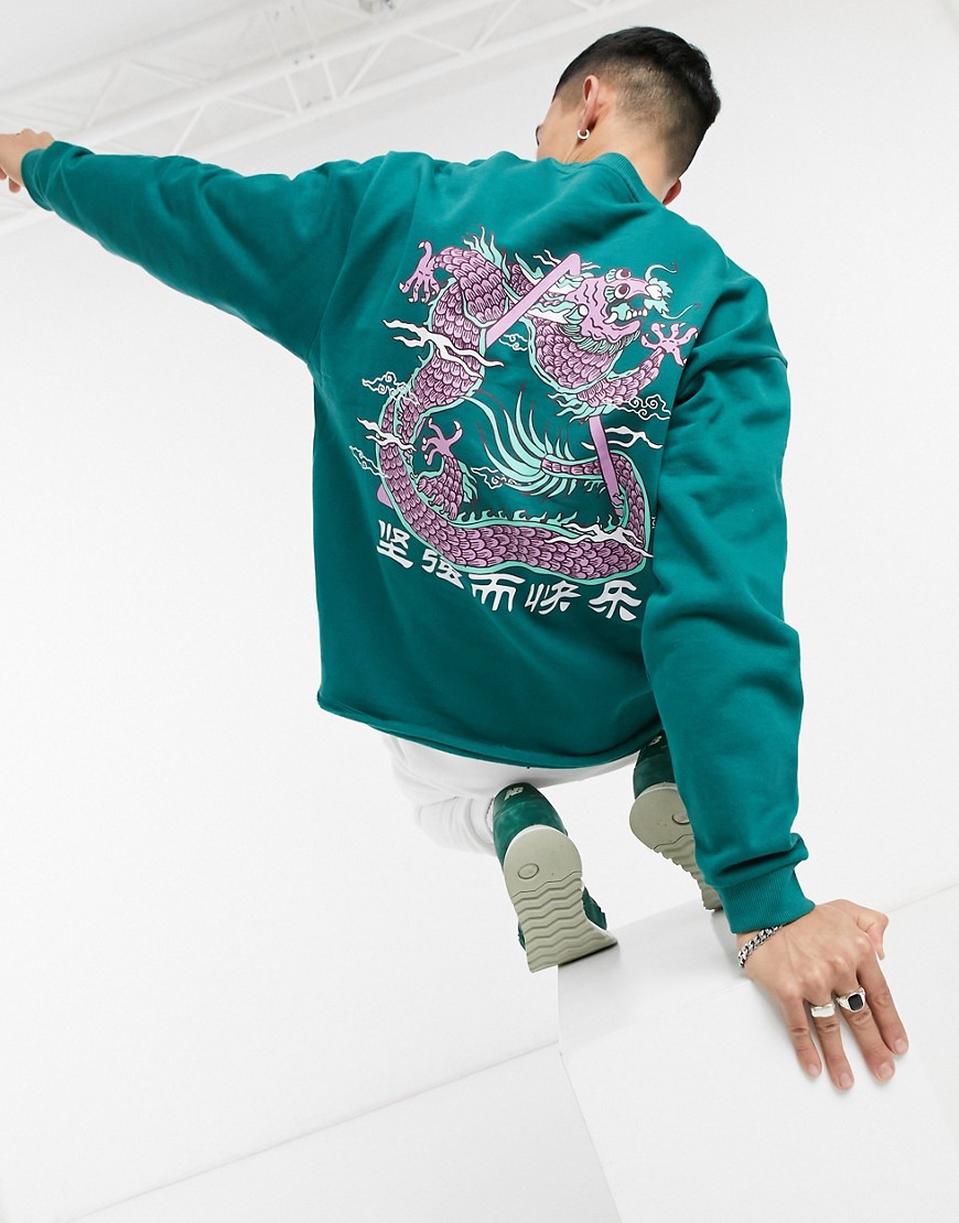 ASOS DESIGN oversized sweatshirt with back snake print and raw edge-Green