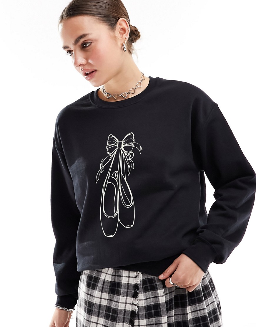 ASOS DESIGN oversized sweatshirt with bow graphic in black