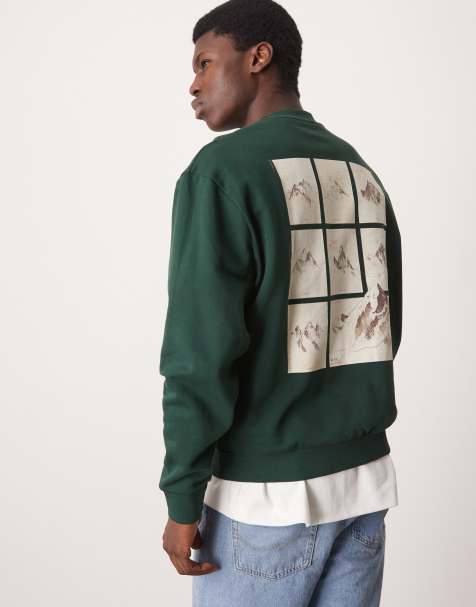 ASOS DESIGN oversized sweatshirt with chest embroidery and mountain back print in dark green - view 1