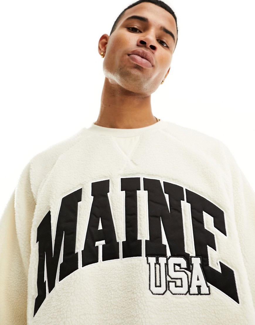 ASOS DESIGN oversized sweatshirt with city print in off white borg
