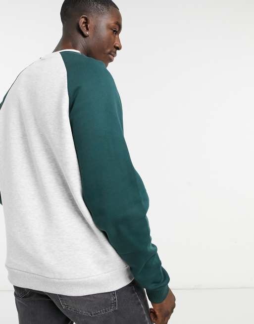 ASOS DESIGN sweatshirt with contrast raglan sleeves and raw edge