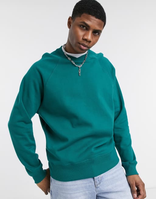 ASOS DESIGN oversized sweatshirt with crossover & t-shirt neck in green