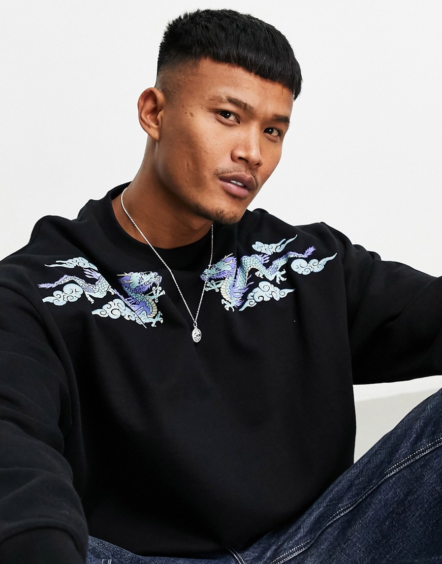 ASOS DESIGN oversized sweatshirt with dragon shoulder prints in black