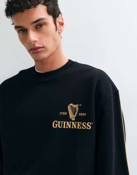 ASOS DESIGN oversized sweatshirt with Guinness in Black - view 1