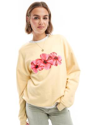 ASOS DESIGN oversized sweatshirt with hibiscus graphic in baby ecru-White