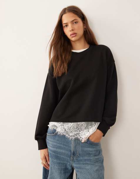 ASOS DESIGN oversized sweatshirt with lace hem underlayer detail in black - view 1