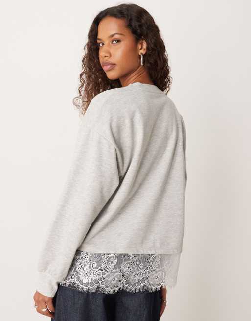 ASOS DESIGN oversized sweatshirt with lace hem underlayer detail