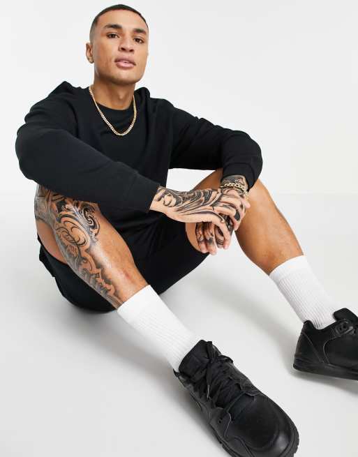 ASOS DESIGN oversized sweatshirt with NFL embroidery and back print in black