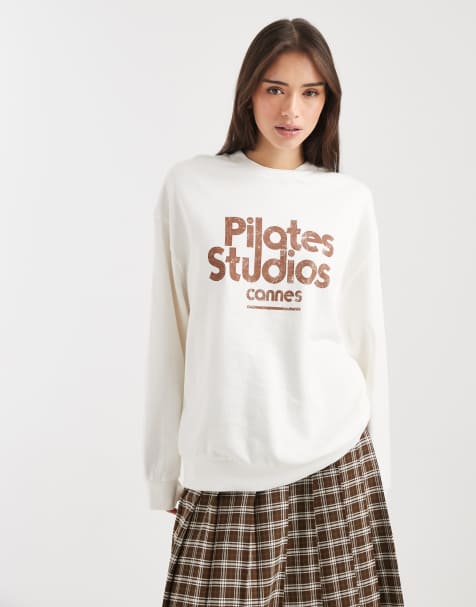 ASOS DESIGN oversized sweatshirt with pilates studio graphic in cream