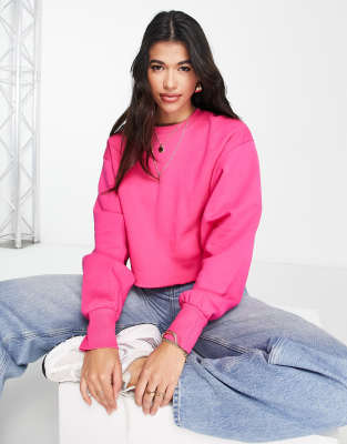 ASOS DESIGN oversized sweatshirt with raw hem in bright pink