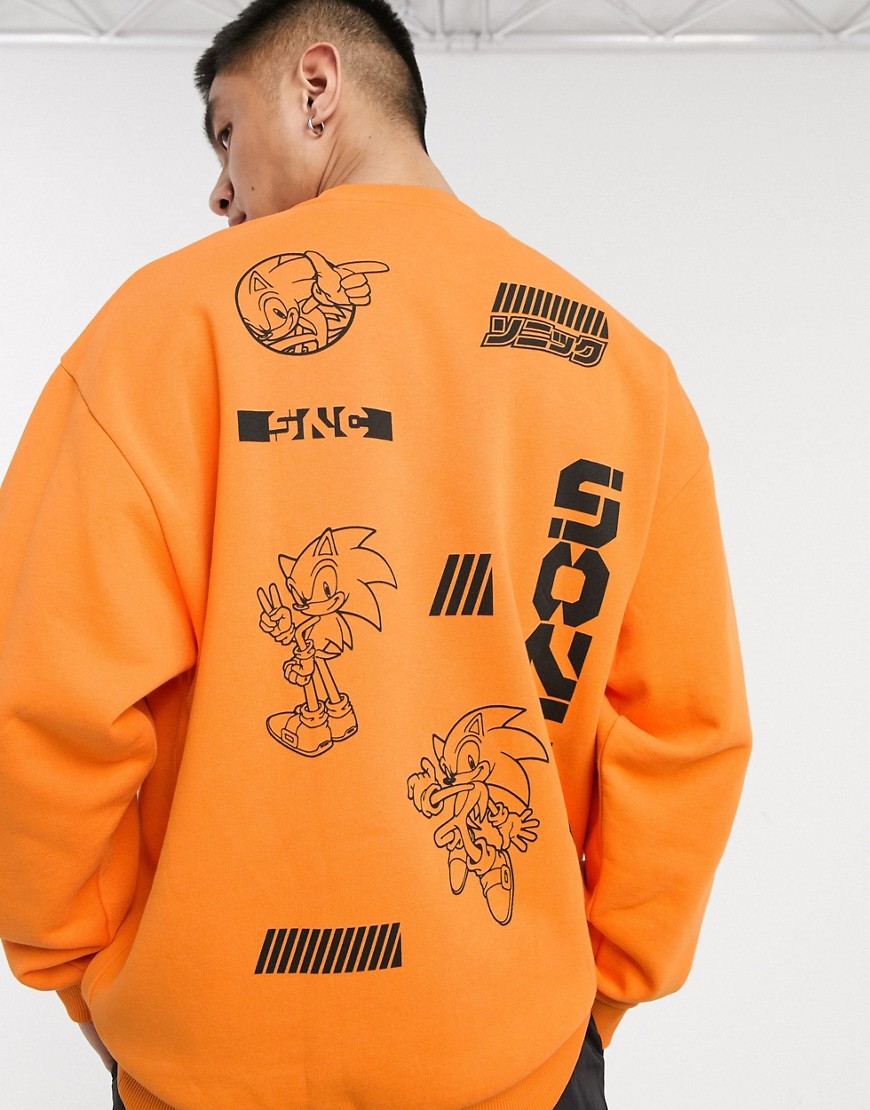 ASOS DESIGN oversized sweatshirt with Sonic multi placement print-Orange