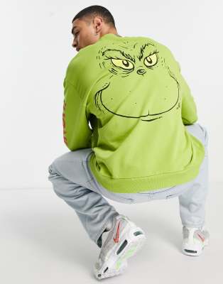 ASOS DESIGN oversized sweatshirt with The Grinch print in green | ASOS