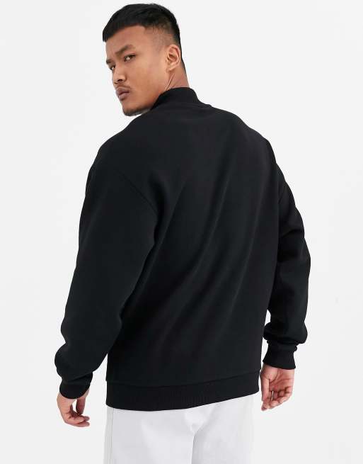 ASOS DESIGN oversized sweatshirt with NFL embroidery and back print in black