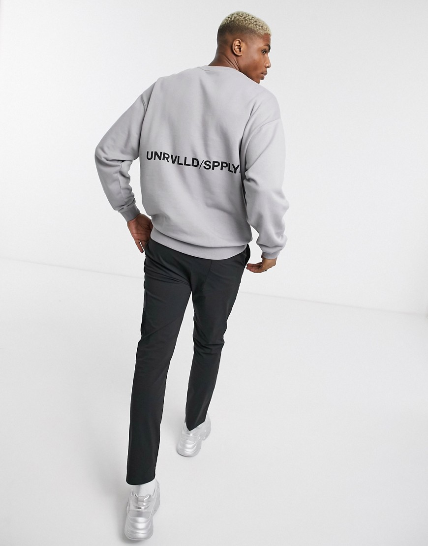 ASOS DESIGN oversized sweatshirt with unrvlld/supply text print in grey